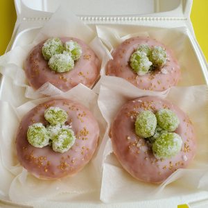 Rosé champagne glazed Mother’s Day donut topped with rosé-aged sugar green grapes, elegantly presented in a gift box.