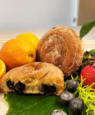 Close-up of Jarams Handcrafted Blueberry Jam Croissant Roll, showing the dark, pure blueberry jam filling.